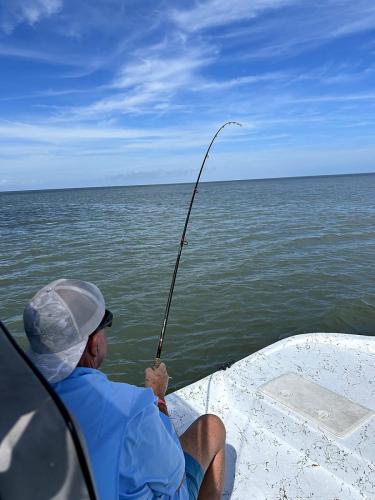 Angler fighting fish