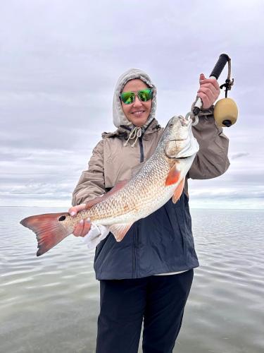 Woman holding a redfish