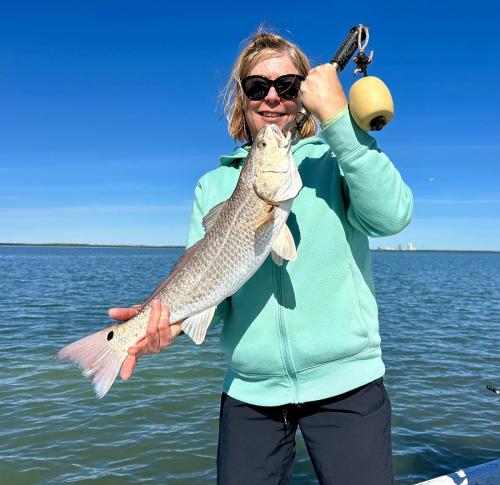 Angler holding a redfish