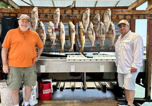 Two anglers with the day’s catch