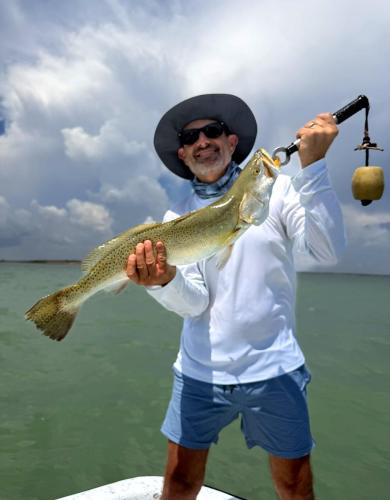 Guest holding a big speckled trout
